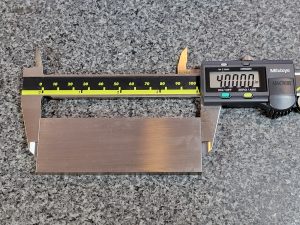 mitutoyo digital caliper measuring 4 inch block