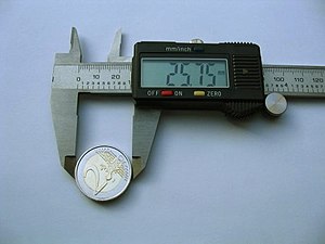 digital caliper measuring coin