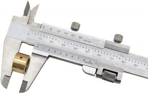 vernier caliper measuring thickness of brass part