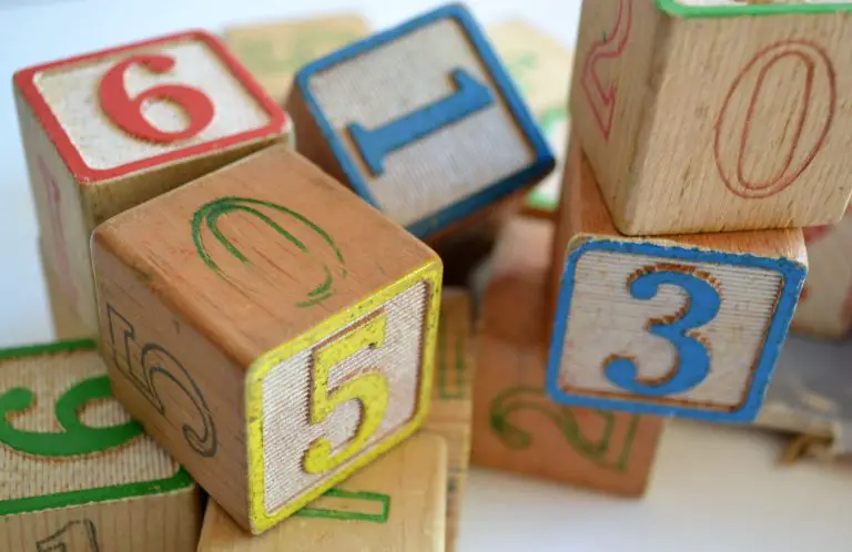 wooden blocks with letters and numbers on them