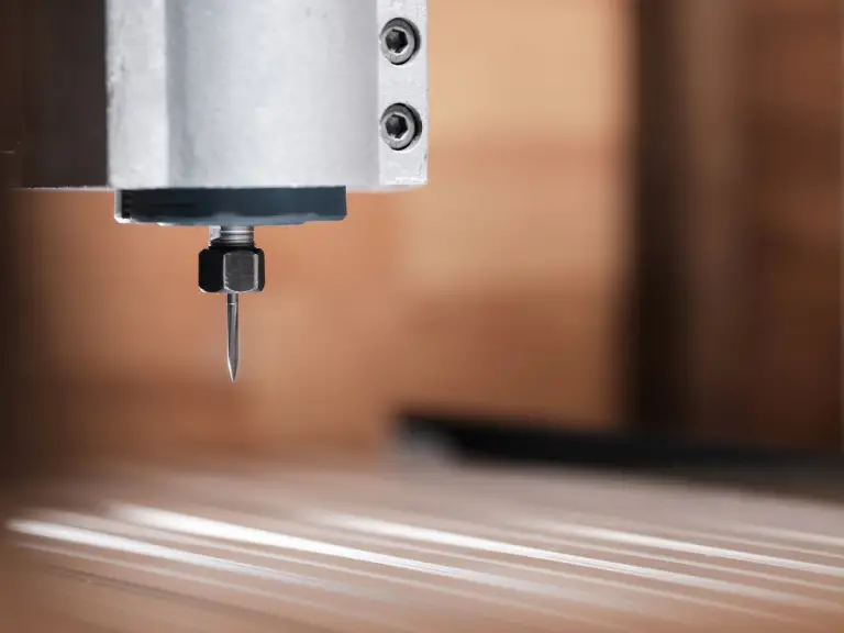 a cnc router with a carving bit installed