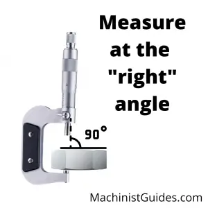 a micrometer measuring a part at 90 degrees