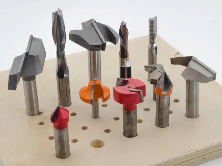 a router bit organizer with multiple router bits in it