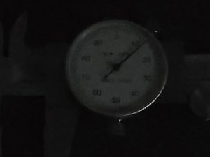 example of trying to read a dial caliper in bad lighting conditions