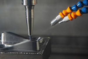 oil mist coolant being applied to a cnc machine cutting tool