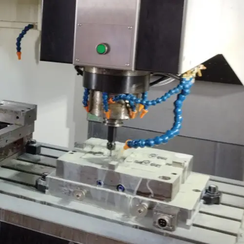 Coolant lines cnc machine table with coolant lines and spindle shown