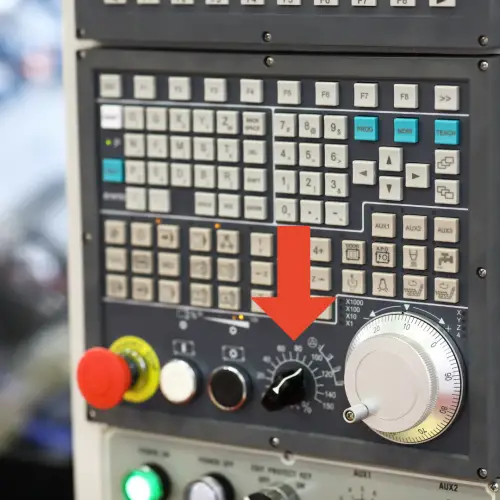 cnc control board with rapid travel dial identified with arrow